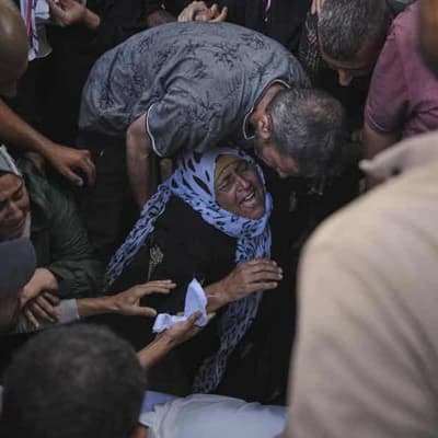 Dozens waiting for aid among 94 killed in Gaza