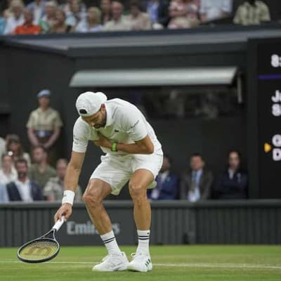 Injury rescues world No.1 from early Wimbledon exit
