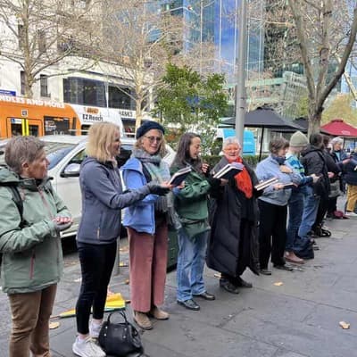 Tome by tome, human chain moves historic bookstore