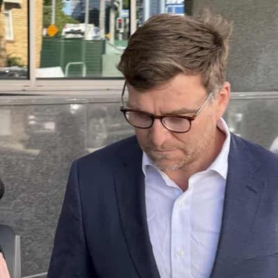 Bank exec charged with seeking girls for sex gets bail