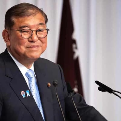 Japan's PM vows to stay on after bruising election loss