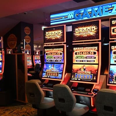 Pokies giant taken to court over money laundering gaps