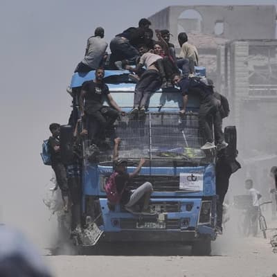 At least 20 killed in Gaza as aid truck overturns