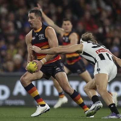 Adelaide edge Collingwood in thriller to keep top spot