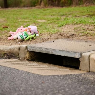 Woman assisting police after baby found in storm drain