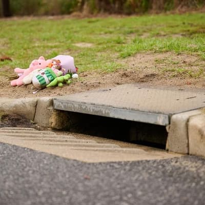 Mother charged after dead baby found in storm drain