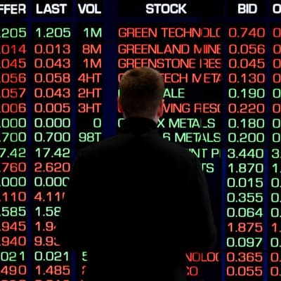 Australian shares drop while gold glitters to new high