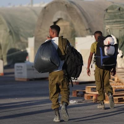 Reservists report for duty, Netanyahu accelerates push