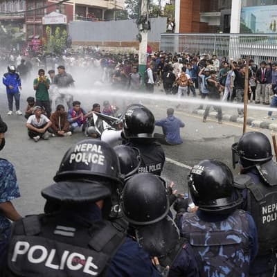 Police in Nepal open fire on protesters, killing 11