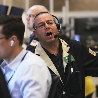 Nasdaq notches record high close, traders eye rates