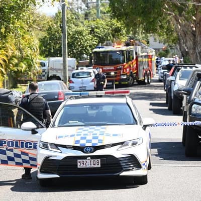 Man shot in backyard by police responding to house fire