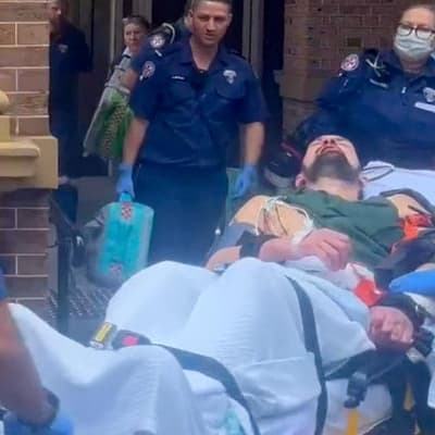 Bloodied murderer leaves in ambulance, not prison van