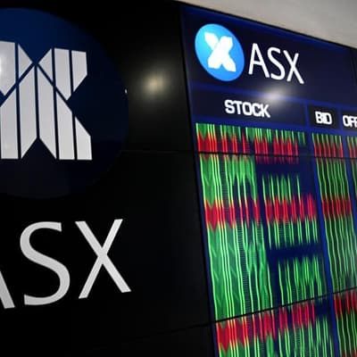 Australian shares retreat from highs as caution returns