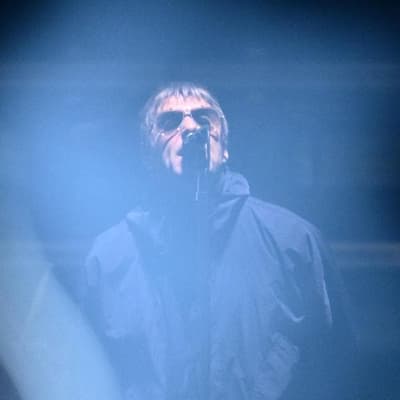 Oasis frontman unleashes after flares thrown into crowd