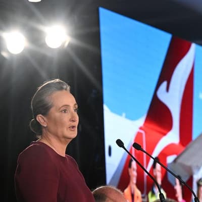 Qantas shares at six-month low as business travel slows