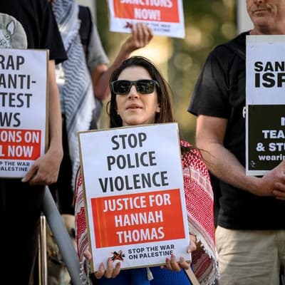 'Relief' as cop charged with assaulting protester named