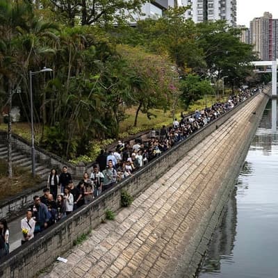 Anger over deadly HK blaze as Beijing issues warning