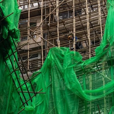 HK races to remove mesh blamed for fuelling deadly fire