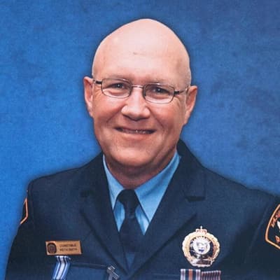 Dispute over alleged cop killer's court attendance