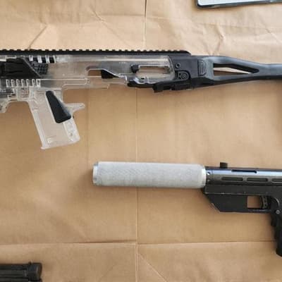 Two teens charged among six arrested in gun raid