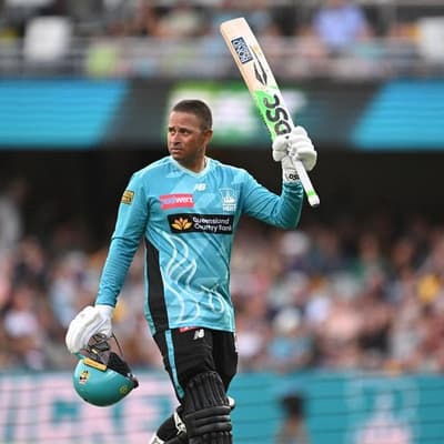 Khawaja shines, Warner hurt as Heat thump Thunder