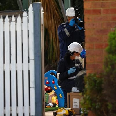 Mother charged over kids' deaths in fire skips court