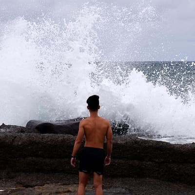 Woman dies as wild weather lashes east coast