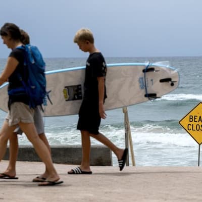 Shark attacks close beaches amid stormy weather warning