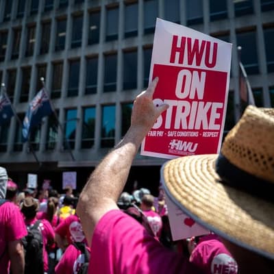 Enraged health workers bring strike to premier's door
