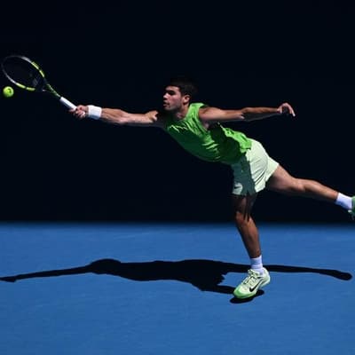 Alcaraz swings with Federer while chasing career slam