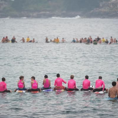 'Loved life': mass paddle-out for young shark victim