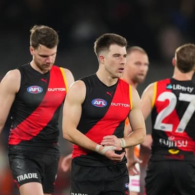 Merrett misses Essendon's team photo because of illness