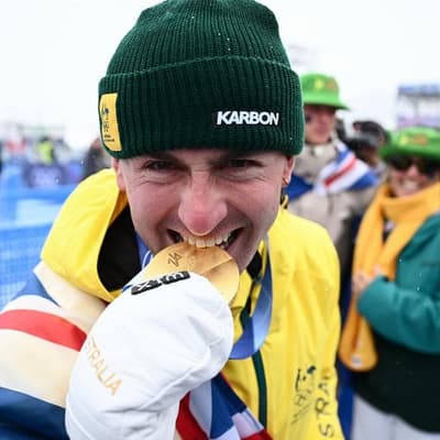 Hungry for gold: Woods chases another in dual moguls