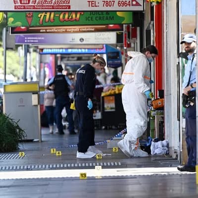 One dead in 'random' triple stabbing on high street