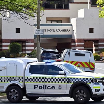Charges after 'lit incendiary device' thrown into hotel