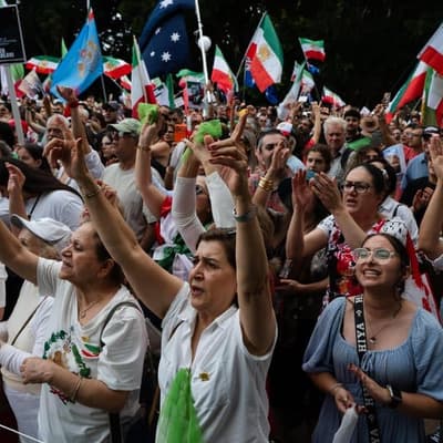 Iranians celebrate as PM warns of limited assistance