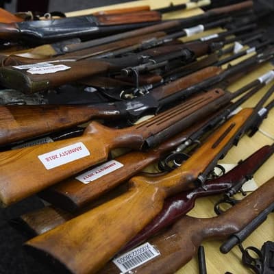 Union boss charged after police find 167 guns and cash