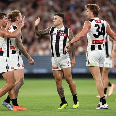 Collingwood open AFL season with tight win over Saints