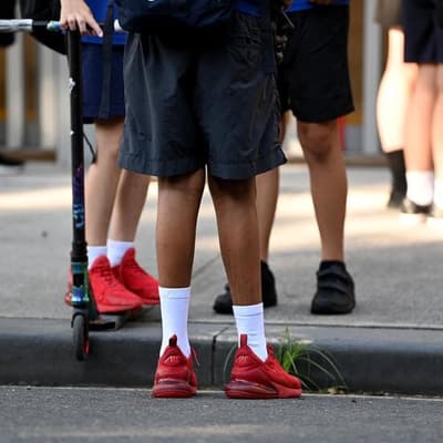 Four teachers charged with assaulting young students