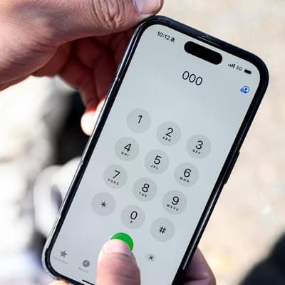 Foreign owner apologises for Optus triple-zero failures