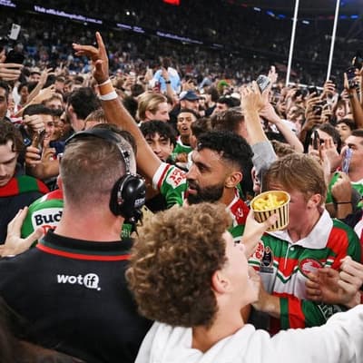 Arrests, charges amid pitch invasion for NRL hero