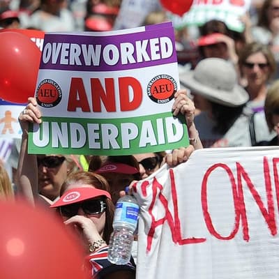 Schools to stay open as teachers strike over pay deal