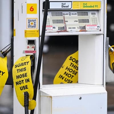 Embattled motorists win bowser relief as taxes slashed