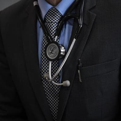 Former doctor charged with 94 counts of rape