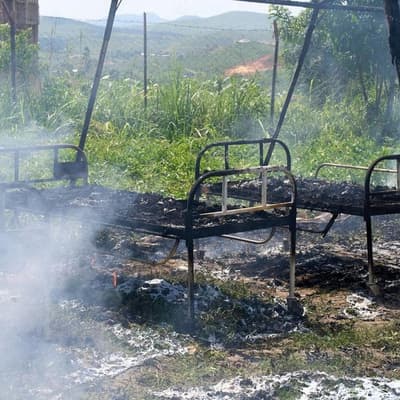 Protesters set fire to Ebola tents in dispute over body
