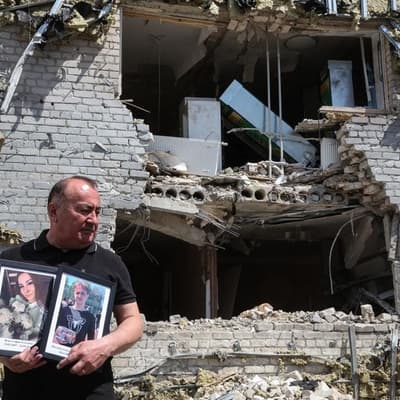 Forensic experts sift through drone hit dormitory