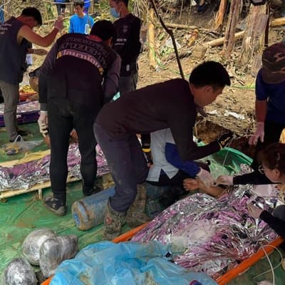 Four rescued from flooded Laos cave, two still missing