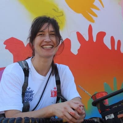 Mural artists creating downtown city wonderwalls