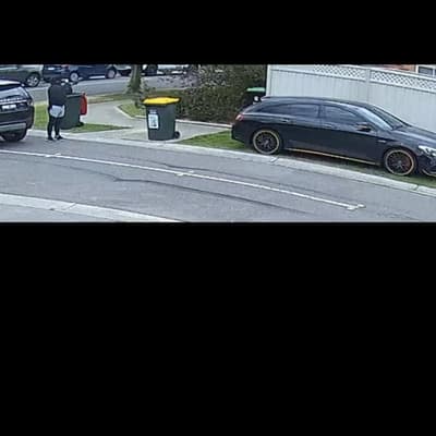 Footage shows masked gunman firing on suburban street