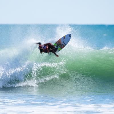 Robinson snaps two boards but survives thrilling heat